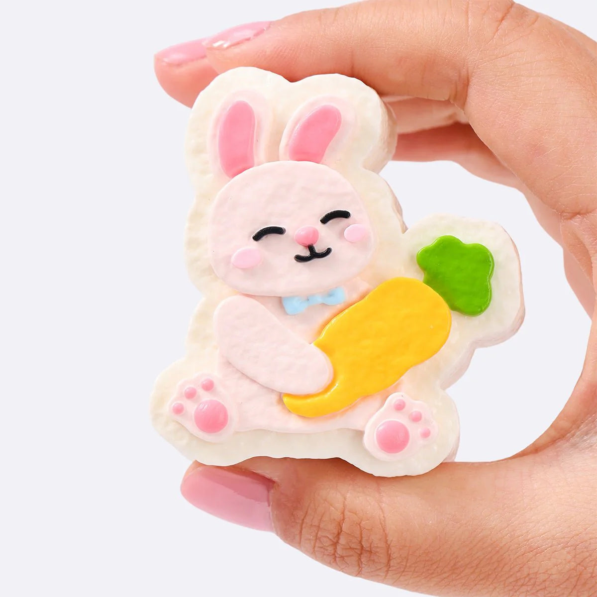 Pink Rabbit Holding Carrot