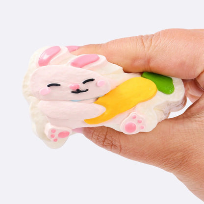 Pink Rabbit Holding Carrot